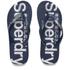 Women?s ?Mainline? flip flops from Superdry. Constructed with a classic flip flop design, the sandals feature a textured toe thong set upon a branded footbed. A textured rubber outsole provides additional traction. Complete with signature Superdry branding to the straps.  Upper: PVC. Sole: EVA.