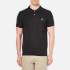 BOSS Orange Men's Pascha Polo Shirt in black with BOSS Orange square branding on the chest. Made from pure cotton piqué, the slim fit 2 button polo shirt features branded buttons and ribbed knit collar and sleeves. - A.D.  100% CottonModel is 188cm/6'2  and wears a size M.