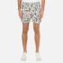 Men's printed swim shorts from Selected Homme with durable nylon construction and regular fit. Adorned with an exotic leaf and floral print, the 'Sunset' swim shorts feature a drawstring waist, breathable mesh lining and two pockets for practicality.  100% Nylon.