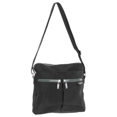 CLOSEOUTS . A friend you can rely on to keep your essentials within reach, baggalliniand#39;s Comrade crossbody bag boasts a plethora of pockets in light, water-resistant nylon for holding everything from a tube of lipstick to a paperback book. Available Colors: CHARCOAL, PEWTER FLORAL, BLACK/SAND LINING, ADOBE.