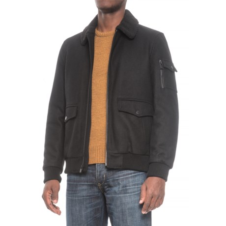 CLOSEOUTS . Halifax Tradersand#39; sherpa collar bomber jacket combines distinguished style and fabric with a sporty bomber jacket silhouette for a unique, refined look. A sherpa fleece collar, ribbed trim at the cuffs and hem, and a thin layer of insulation act as a cozy buffer between you and the cold winter air. Available Colors: BLACK, CHARCOAL. Sizes: S, M, L, XL, 2XL.