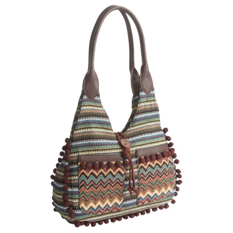 CLOSEOUTS . A soft fabric tote punctuated with mini pompoms and designed to carry anywhere, Bandana by American Westand#39;s Tulum Scoop Top tote bag is made with Native American-inspired woven tapestry and faux-leather detail. With room for the essentials in the main compartment, this richly hued bag also features pockets inside and out for keys, phone, glasses and more. Available Colors: DARK BROWN, BLACK, TAN.