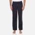 Tommy Hilfiger woven pyjama pants adorned with the label's embroidered mini flag logo. Crafted from pure cotton for sublime comfort, the lounge pants comprise a branded, elasticated waistband, a buttoned fly and straight legs. Tonal stitching throughout.  100% Cotton Model is 188cm/6'2  and wears a size M.