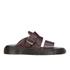 Dr. Martens unisex ?Brelade? slide sandals with Analine leather strap uppers. Essentially a reworking of Dr Martens? classic 1461 low-top silhouette, the slip-on sandals feature an adjustable buckle strap to the upper which is secured to a chunky air-cushioned sole via a classic Goodyear-welt, using PVC for the welt. Complete with signature Dr. Martens branding embossed to the footbed.  Upper: Analine Leather. Sole: PVC.  Made in England