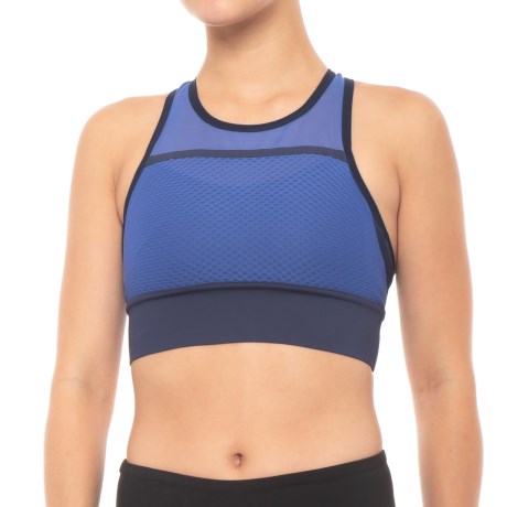 CLOSEOUTS . Take on a hot day run in this New Balance Determination sports bra, made from breathable, wicking and fast-drying NB Dry fabric for cool comfort no matter the distance, plus compression support for moderate-impact activities. Available Colors: SOLAR YELLOW, ELDERBERRY, VIVID CORAL, BLUE IRIS. Sizes: XS, S, M, L, XL.