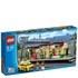Take a taxi to the busy LEGO&reg; City Train Station, a place that never sleeps! On arrival, go up the stairs and through the opening doors. Check the time on the large clock hanging from the roof and the map of train services by the ATM. While you wait for your train, browse around the shop selling LEGO&reg; City products. Feeling hungry? Head to the kiosk and order a croissant or pizza and a drink from the menu signs hanging above the desk. Then take a seat on the clean platform, enjoy your snack and relax. Includes 5 minifigures: conductor, chef, taxi driver and 2 travelers.    Includes 5 minifigures: conductor, chef, taxi driver and 2 travelers  Features a main entrance with stairs, opening glass doors, ATM, train map, LEGO&reg; City shop with LEGO City products, desk and cash register, plus a food and drink kiosk with a cash register, coffee machine, 4 beverage bottles, 2 menu signs, croissant and a pizza  Train platform features a cross-track roof, clock, steps, 2 seats, bicycle, bicycle stand, 2 monitors, 2 security cameras and 2 trash cans  Includes a cool yellow taxi  Also includes 4 connecting rail tracks  Accessories include a suitcase, newspaper, sausage and a train conductor sign  Park the taxi at the main entrance  Check the train map and the time on the clock  Buy a croissant and a drink from the kiosk  Take a seat on the platform and read the newspaper  Train Station measures over 5&rdquo; (13cm) high, 19&rdquo; (50cm) wide and 8&rdquo; (21cm) deep  Taxi measures over 1&rdquo; (5cm) high, 3&rdquo; (10cm) long and 1&rdquo; (4cm) wide  Rail track pieces each measure over 5&rdquo; (13cm) long and 2&rdquo; (6cm) wide